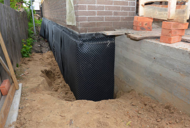 Happy homeowners after waterproofing job in Whiteland